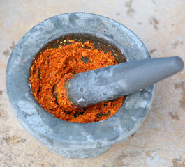 ingredient of curry in mortar mix, curry thai food stye place on cement background