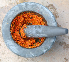 ingredient of curry in mortar mix, curry thai food stye place on cement background