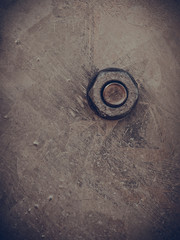 Detailed closeup of screw on indrustrial machinery