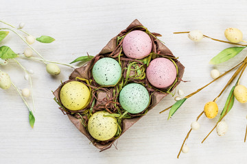 Fototapeta na wymiar Easter spring eggs on white background texture
