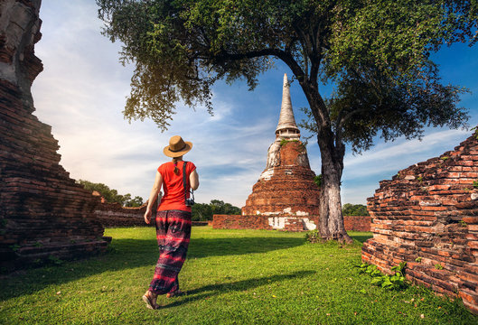 Tourist near ancient temple in Thailand