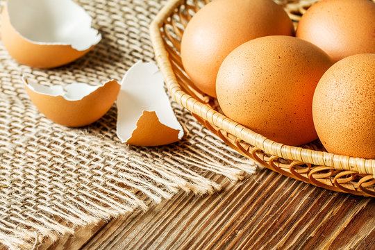 Fresh brown cage free eggs on burlap