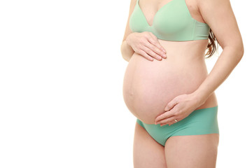 Fototapeta na wymiar お腹を触る臨月の妊婦