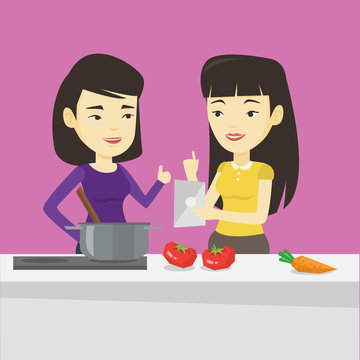 Women cooking healthy vegetable meal.