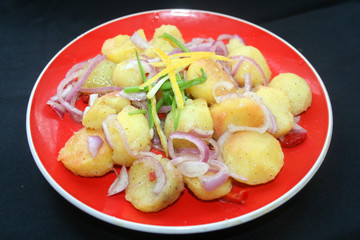 Potato salad with lemon marinade, national cuisine, potatoes, lemons, red onions, Armenian cuisine, Korean cuisine, cold appetizer of potato salad in the pottery, rustic food, peasant food,
