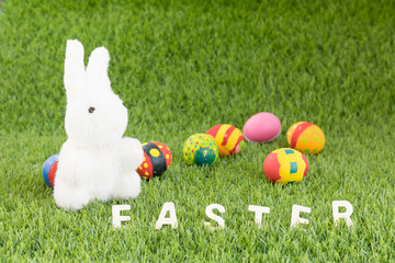 Bunny toy and Easter eggs with text