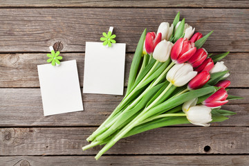 Fresh tulip flowers bouquet and photo frames