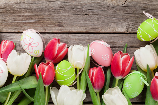 Easter eggs and colorful tulips