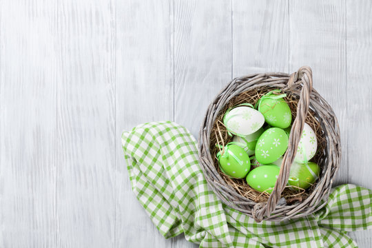 Colorful easter eggs in basket