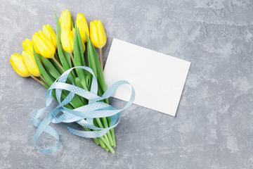 Easter greeting card and yellow tulips