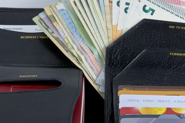 Photo set for the traveller: purse, credit cards, passports and money from different countries