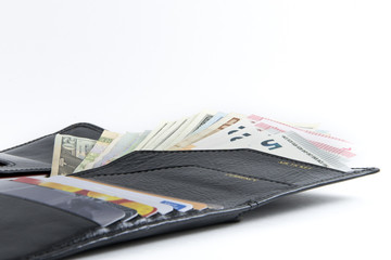 Photo set for the traveller: purse, credit cards, passports and money from different countries