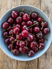 Red cherries in antique bowl
