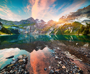 Colorful summer morning on unique lake - Oeschinen (Oeschinensee)