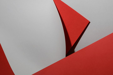 Abstract composition of grey and red paper. Horizontal orientation.