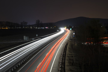 Fototapeta na wymiar Highway by night with car lights trails, Slovakia