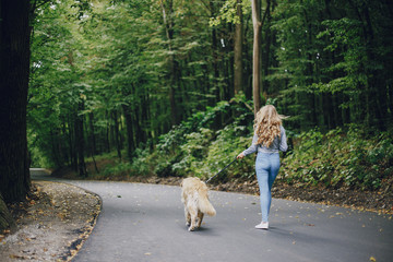 couple walking outdoors with her dog