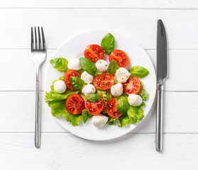 Plate with salad for healthy living, topview