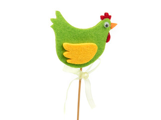 Decorative green rooster with wooden stick. Easter decoration. Interior decor. Rooster isolated on white background.  Closeup.