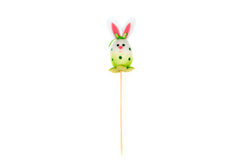 Decorative hare/ rabbit with wooden stick. Easter, spring, summer decor. Cute Interior object. Green hare isolated on the white background. Front view.