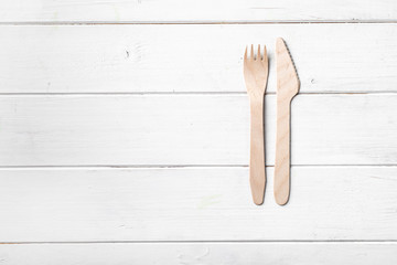 Wooden silverware, topview, text space left