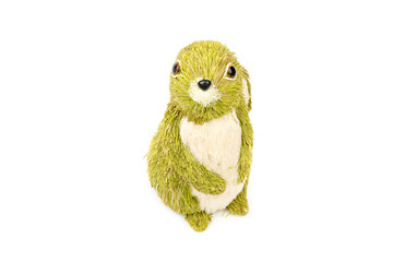 Decorative hare/ rabbit. Easter, spring, summer decor made from natural green, cream white straws. Cute Interior object. Hare isolated on the white background. Top, front view.