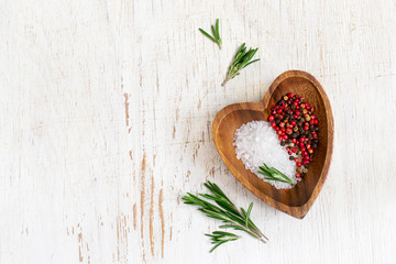 white food background with olive oil, fresh aromatic herbs and spices