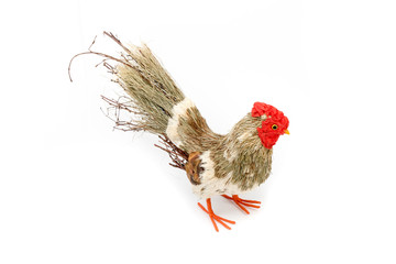 Decorative rooster prepared from natural materials. Easter decoration. Interior, garden decor. Rooster prepared from branches and straws. Isolated on white background. Top, side view.