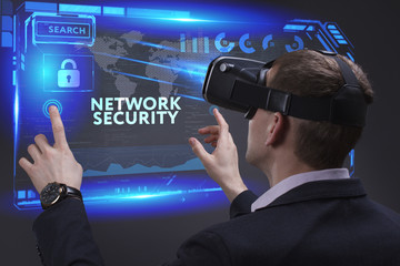 Business, Technology, Internet and network concept. Young businessman working on a virtual screen of the future and sees the inscription: Network security