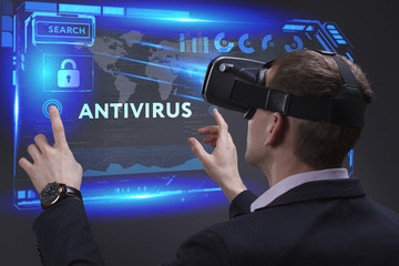 Business, Technology, Internet and network concept. Young businessman working on a virtual screen of the future and sees the inscription: Antivirus