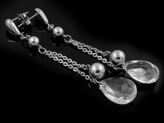 Earrings - Jewelry on a black background © jandix2