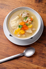 big pot of soup with beef and fresh vegetables