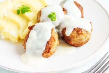 Meatballs with white creamy sauce
