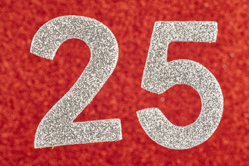 Number twenty-five silver color over a red background. Anniversary.