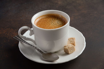 Cup of fresh coffee on dark background, selective focus, copy space