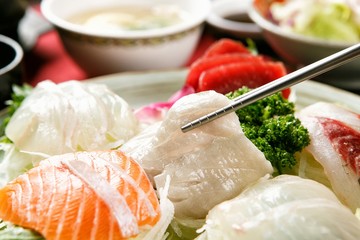 assorted sliced raw fish.