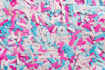 Fototapeta premium pieces of paper in pink and blue colors