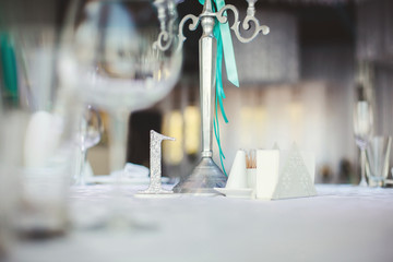 Wedding Banquet in the restaurant, the Tiffany color. Table. Chair. Arch. Tent. Tinsel.