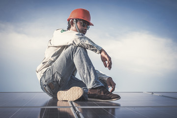 electrician working on installing solar panel in solar power plant