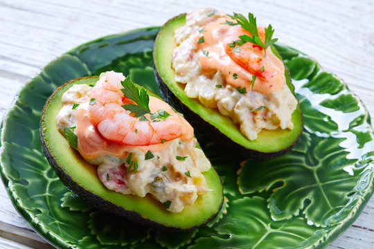 Seafood filled avocado with shrimps tapas pinchos