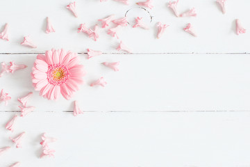 Flowers composition. Pink flowers on white wooden background. Flat lay, top view