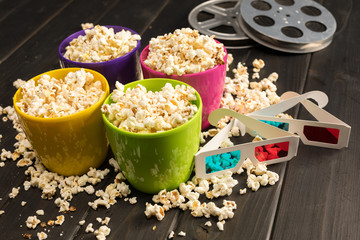 close up view of popcorn in bowls and 3D glasses on table, Movie time concept