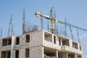 New building is being constructed with use of tower crane