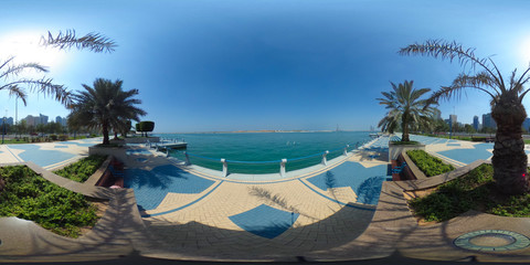 Fototapeta premium 360 degrees spherical panorama of the abu dhabi (UAE) corniche with view of the skyline an blue water