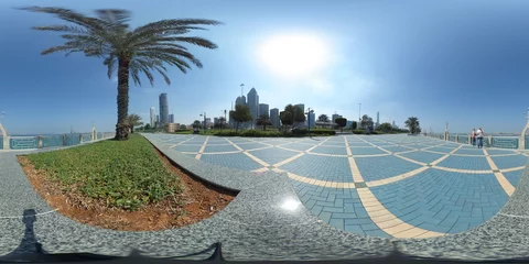Fototapeten 360 degrees spherical panorama of the abu dhabi (UAE) corniche with view of the skyline an blue water © Riko Best