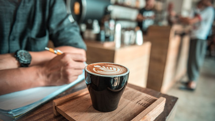 Fototapeta na wymiar Aromatic hot latte art coffee.
