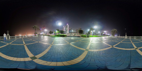 
360 degrees spherical panorama of the abu dhabi (UAE) corniche at night with view of the skyline - obrazy, fototapety, plakaty