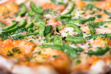 Italian pizza with green pepper in paper box tasty macro picture useful for background