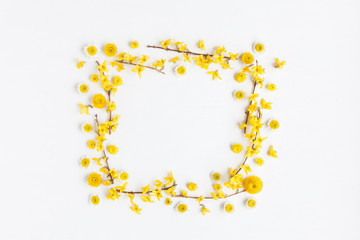 Flowers composition. Frame made of various yellow flowers on white background. Easter, spring, summer concept. Flat lay, top view
