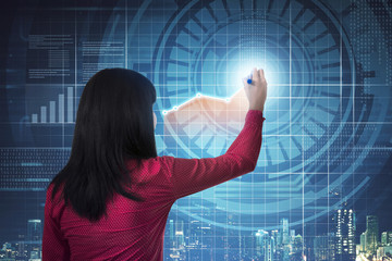 Asian business woman drawing digital chart